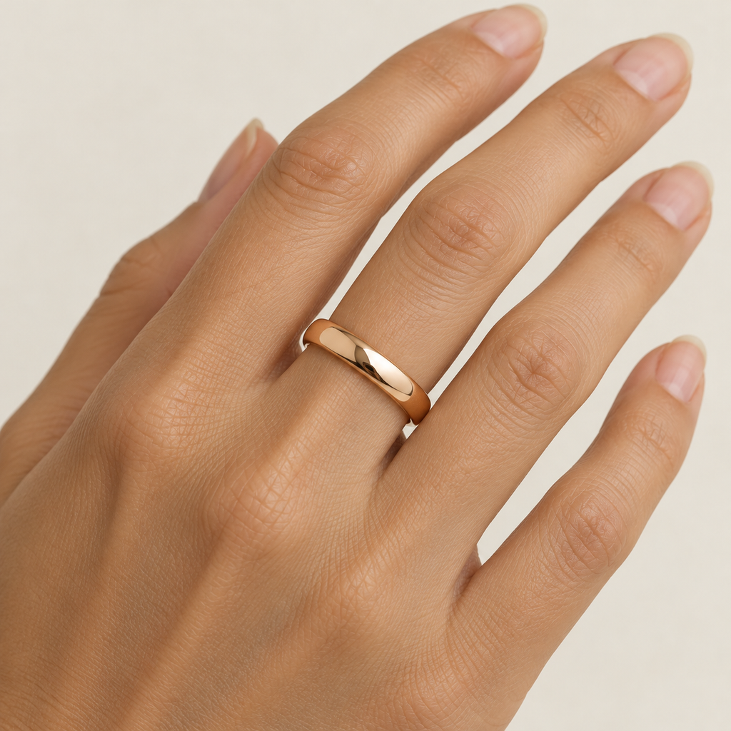 BASTION 4 mm — woman wearing an 18K rose gold wedding band, AI model illustration