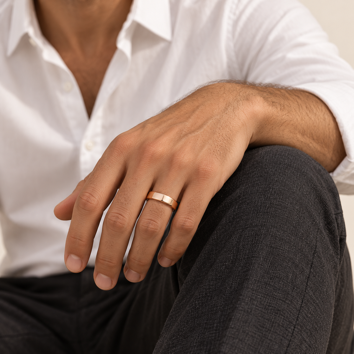 BASTION 5 mm — male model wearing an 18K rose gold wedding band, AI model illustration