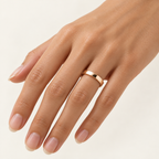 ECHELON 4 mm — woman wearing an 18K rose gold wedding band, AI model illustration