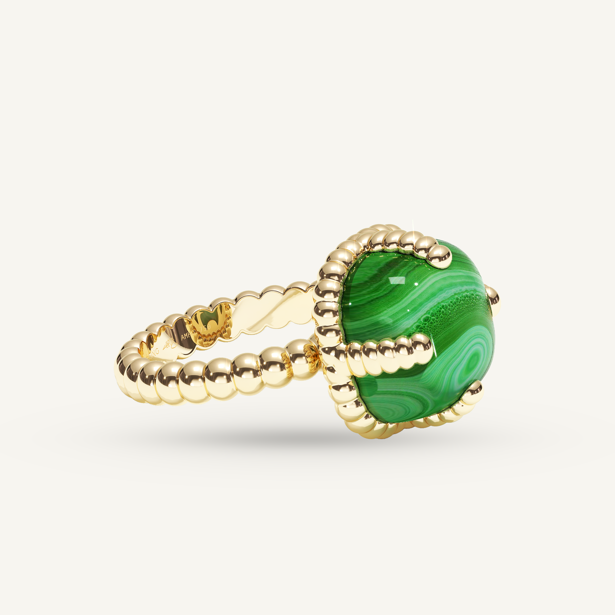 Molekules ring in yellow gold with cushion-shaped malachite, three quarter view