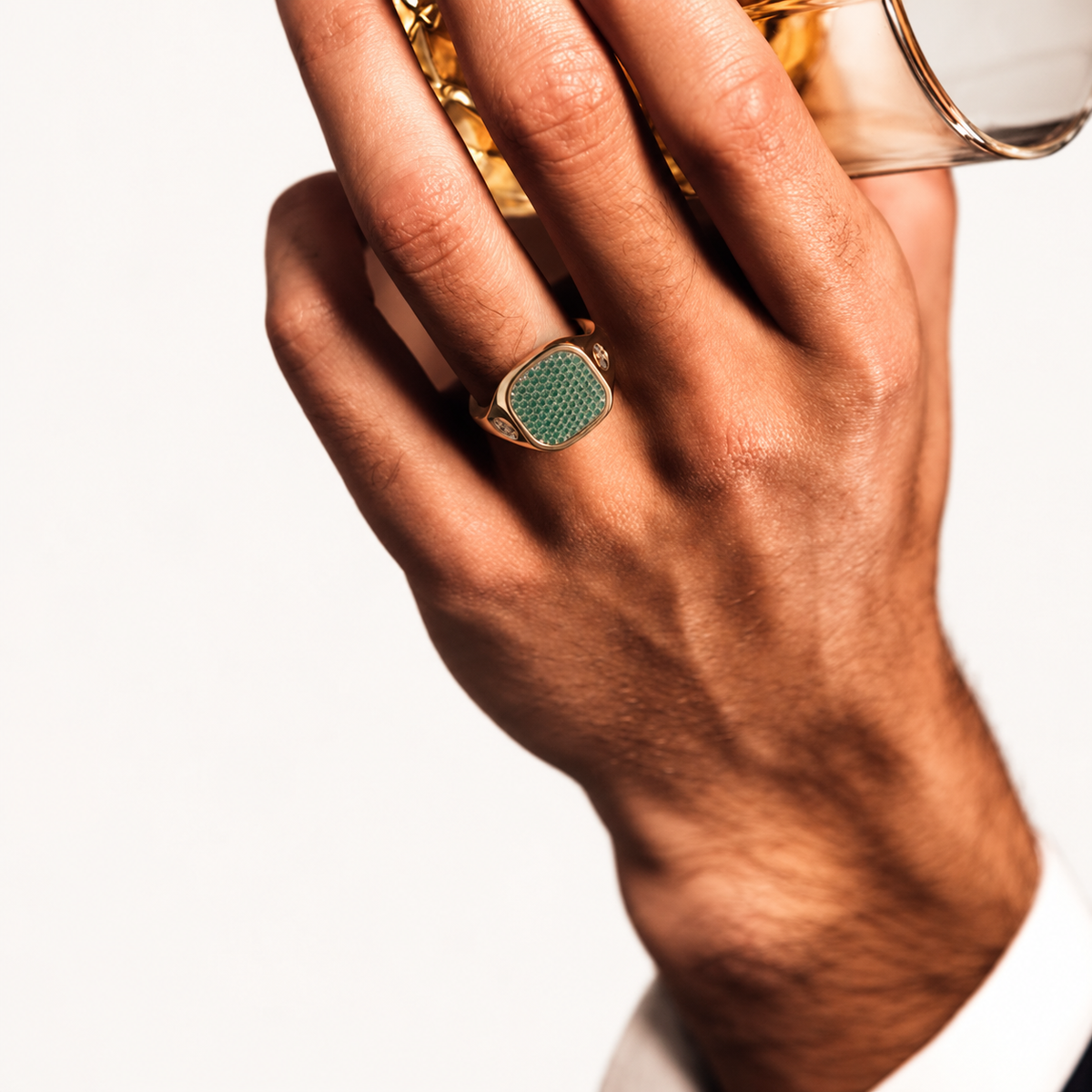 Monogram Signet Pavé Ring in 18k yellow gold with tsavorites – worn on hand