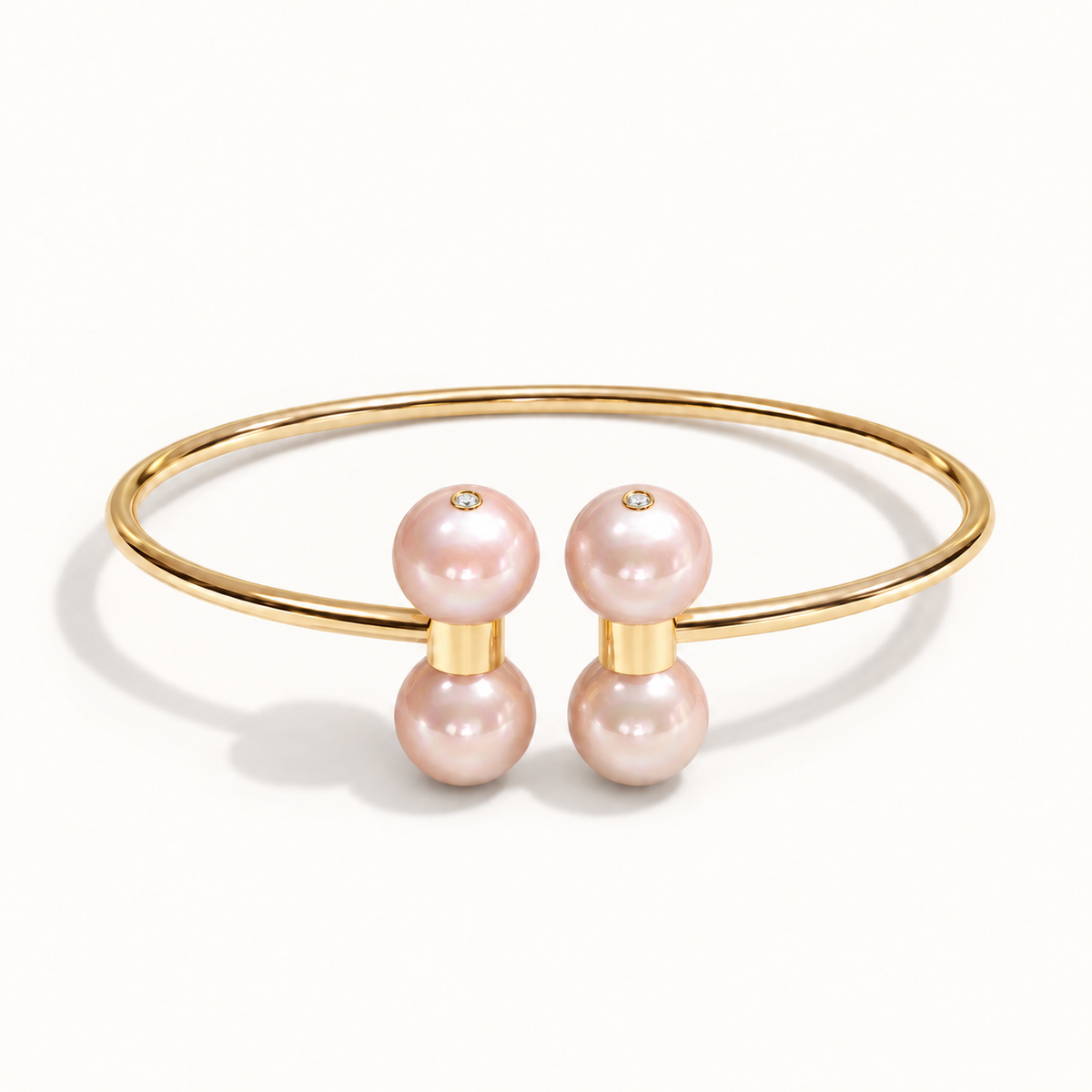 Barbelle Couple Bangle in 18K yellow gold with Pink Freshwater Pearl and bezel-set diamond accents