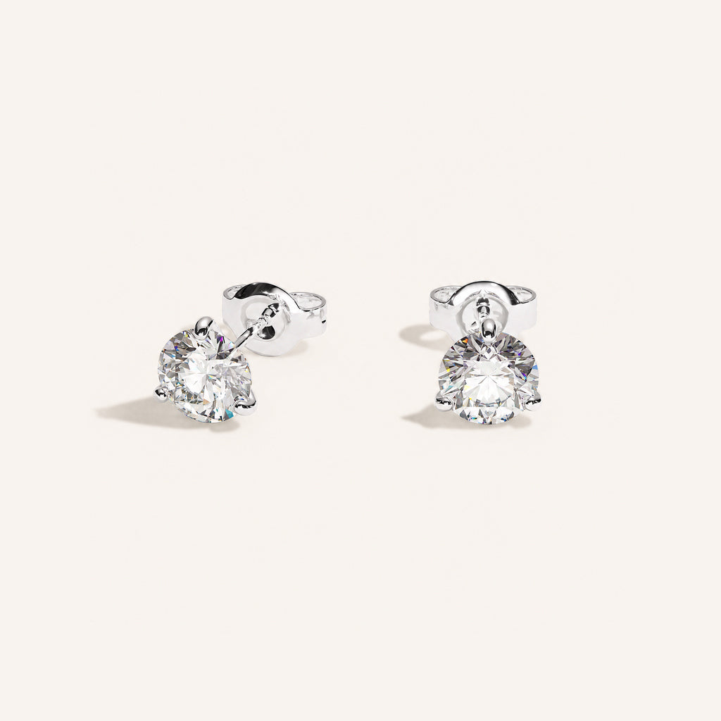 Truine diamond studs, White Gold, 1.00 ct per pair (0.50 ct per diamond), approx. 5.0 mm diameter. Proportional size illustration.