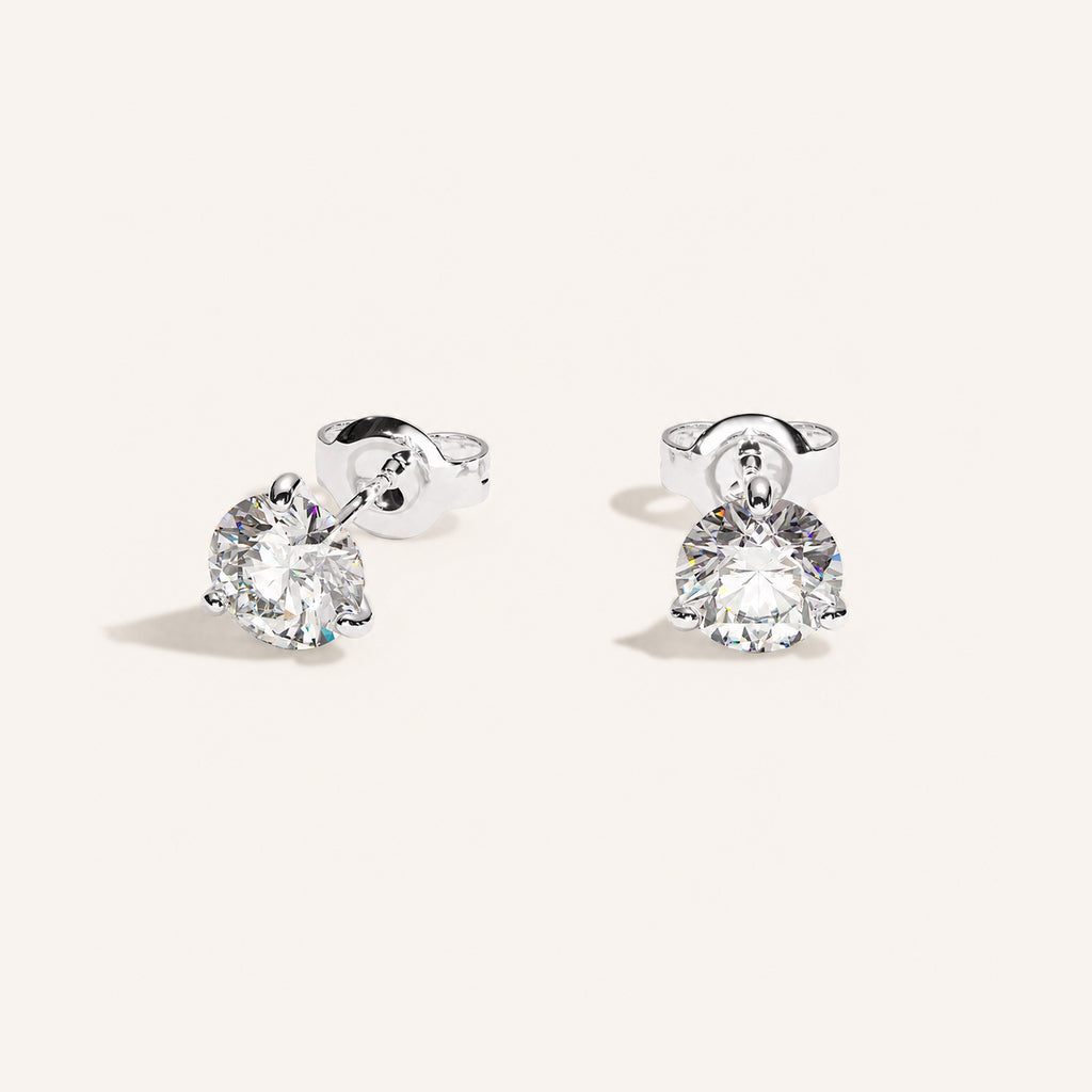 Truine diamond studs, White Gold, 1.20 ct per pair (0.60 ct per diamond), approx. 5.5 mm diameter. Proportional size illustration.