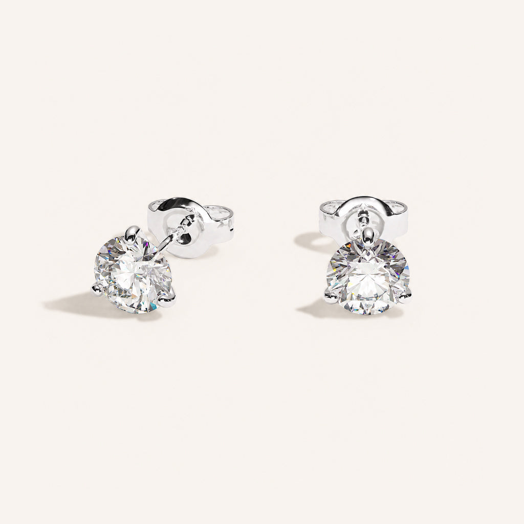 Truine diamond studs, White Gold, 1.40 ct per pair (0.70 ct per diamond), approx. 5.7 mm diameter. Proportional size illustration.
