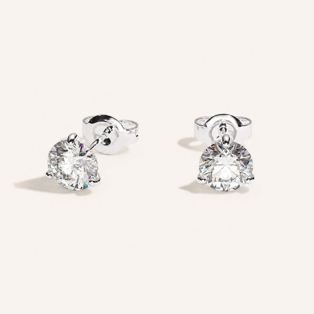 Truine diamond studs, White Gold, 1.80 ct per pair (0.90 ct per diamond), approx. 6.2 mm diameter. Proportional size illustration.