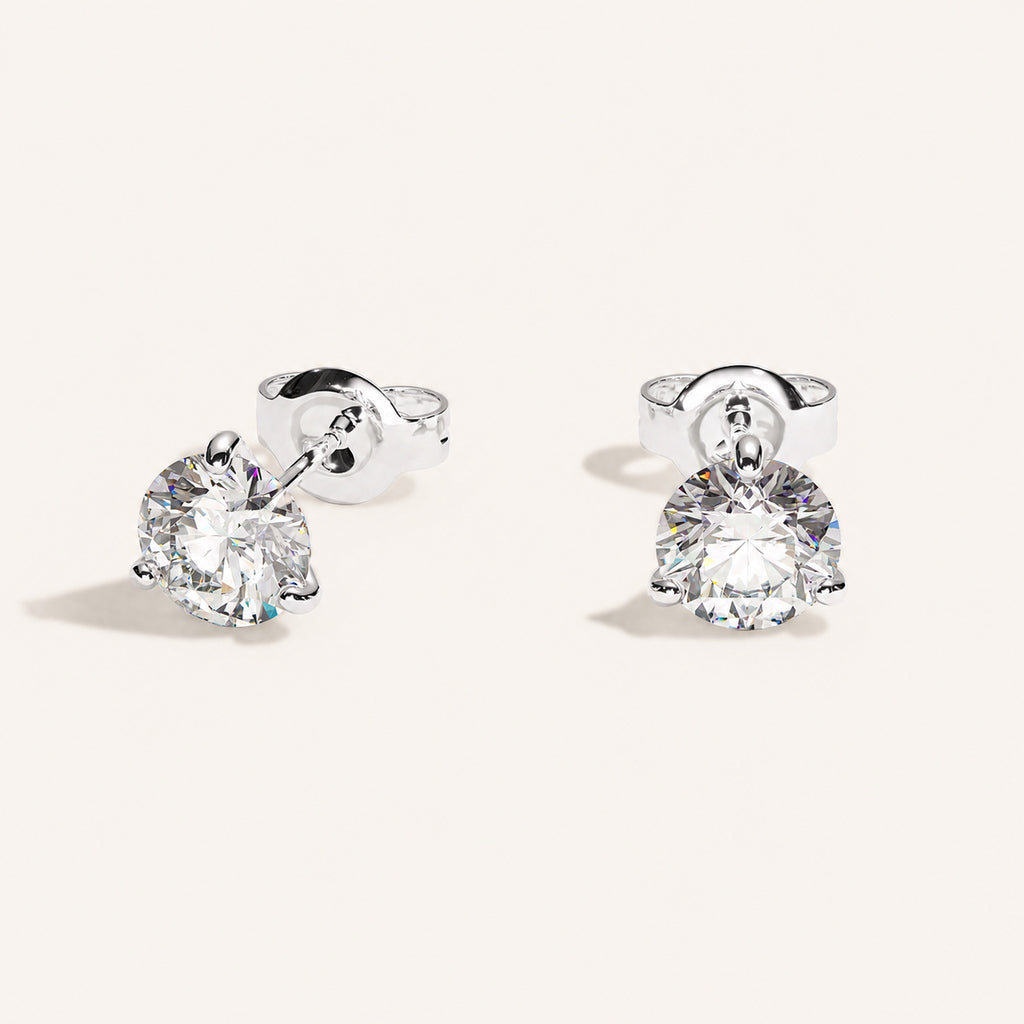 Truine diamond studs, White Gold, 2.00 ct per pair (1.00 ct per diamond), approx. 6.5 mm diameter. Proportional size illustration.