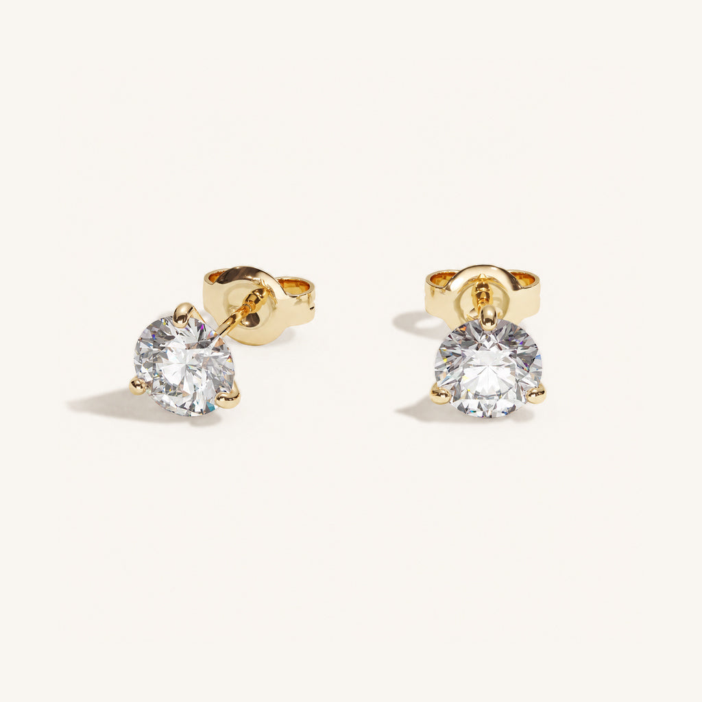 Truine diamond studs, Yellow Gold, 1.20 ct per pair (0.60 ct per diamond), approx. 5.5 mm diameter. Proportional size illustration.